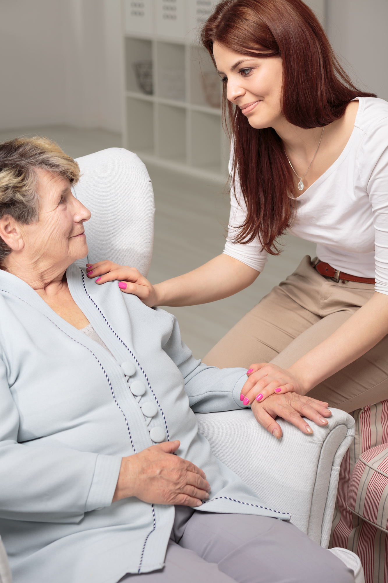 Friendly caregiver taking care of smiling senior woman during meeting at home Comprehensive Columbia Dementia Home Care For Seniors